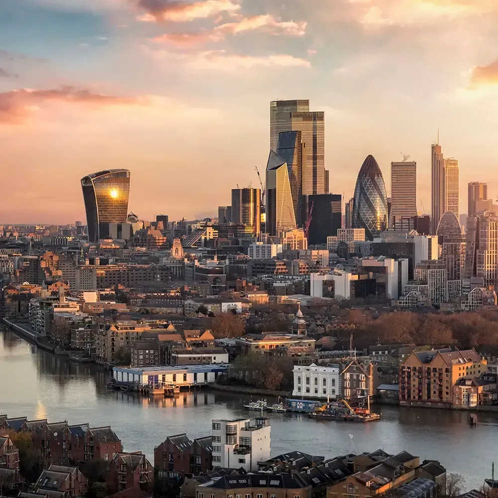 The skyline of London city with Tower Bridge and financial district skyscrapers during sunrise, England, United Kingdom