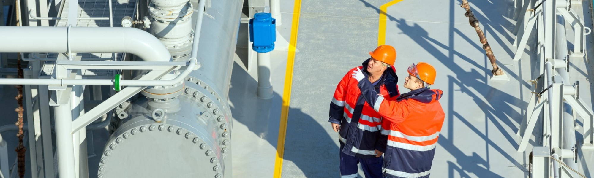 Gas Engineers Inspecting Equipment