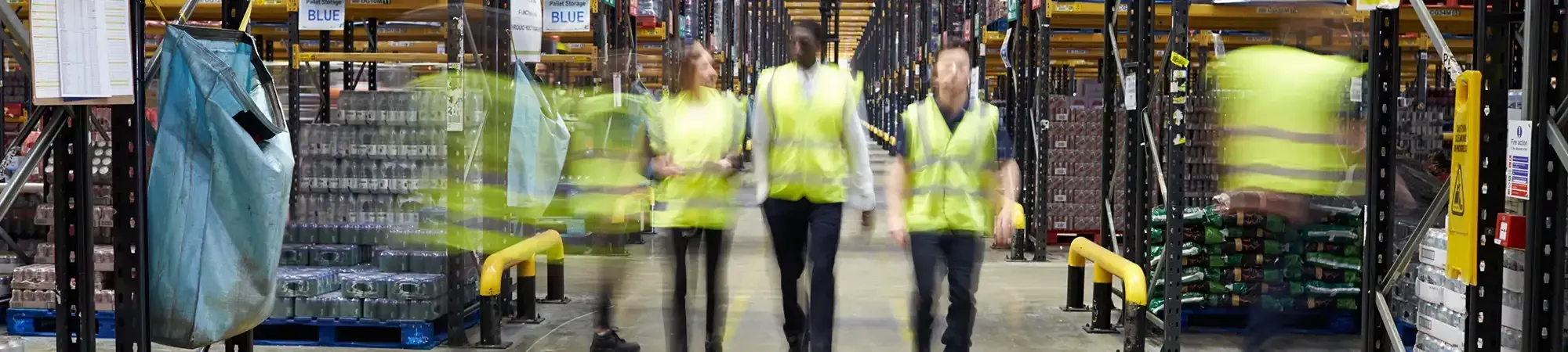 Warehouse working at work in a busy warehouse